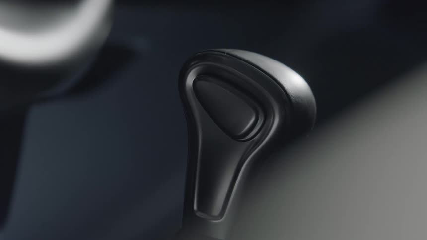 Light shining over a vehicle shifter