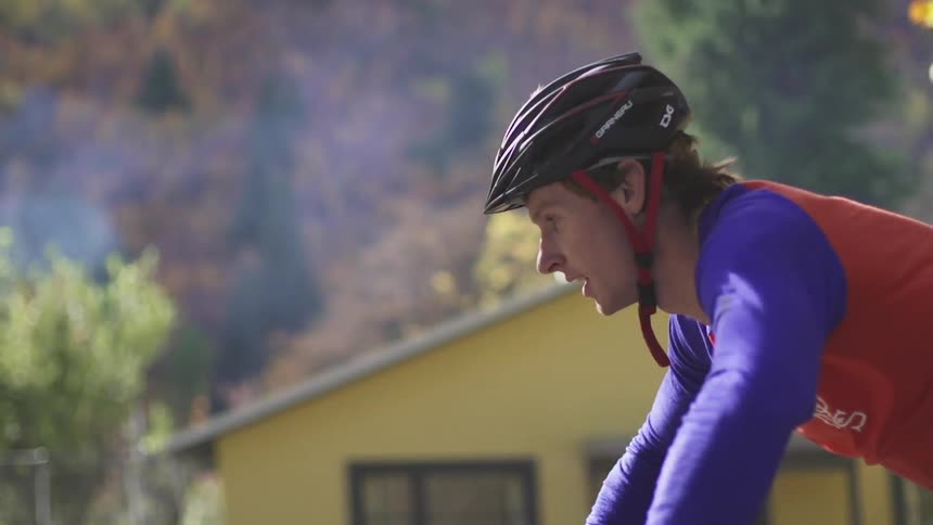 A man riding a bike through a neighborhood