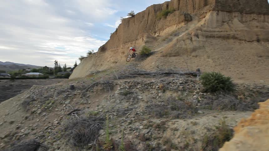 Man riding down a steep rocky hill on his bike