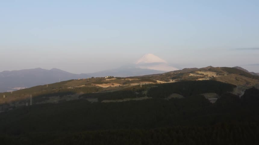 The hills ahead are half covered in shadow