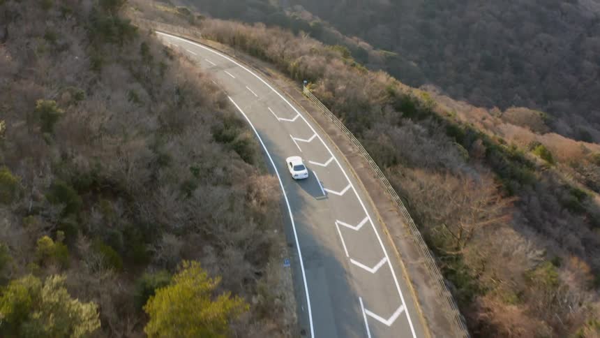 A car travels on a mountain road