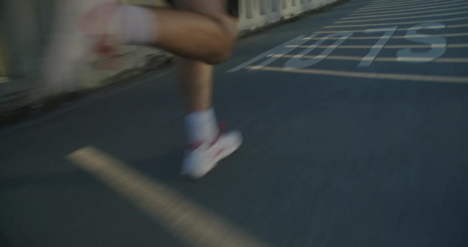 A person is running on the side of the road
