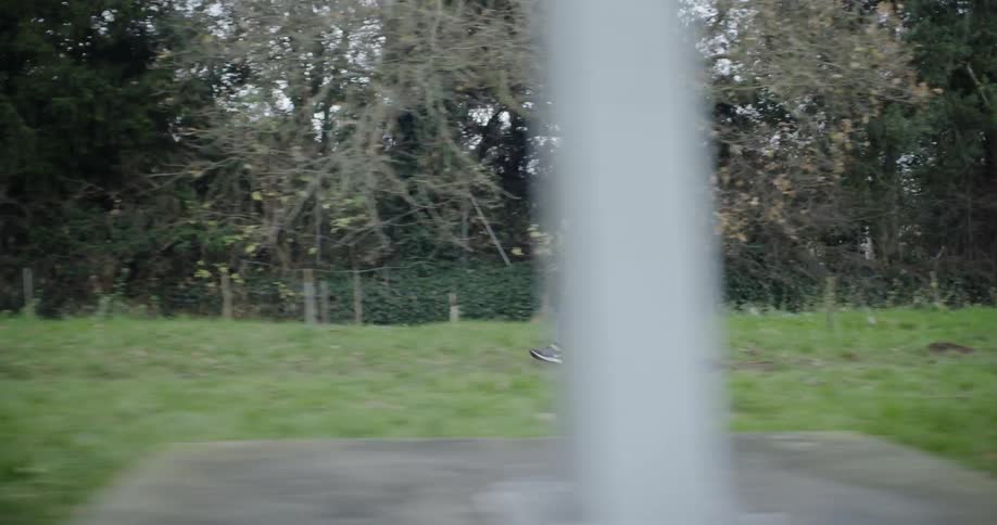 Woman jogging through grassy field
