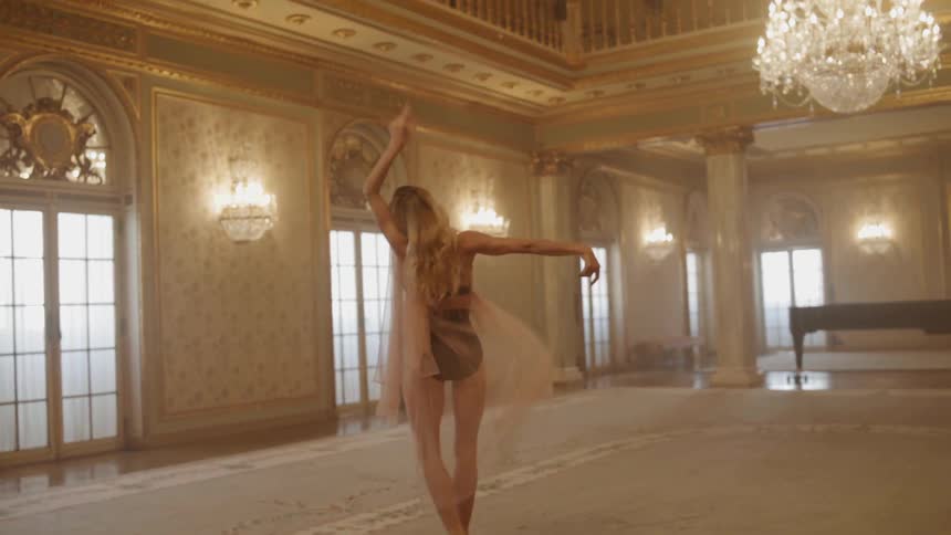 A woman dances in the ballroom