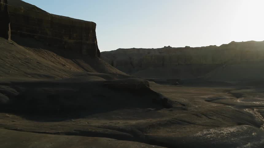 Sun shines over plateaus in a desert