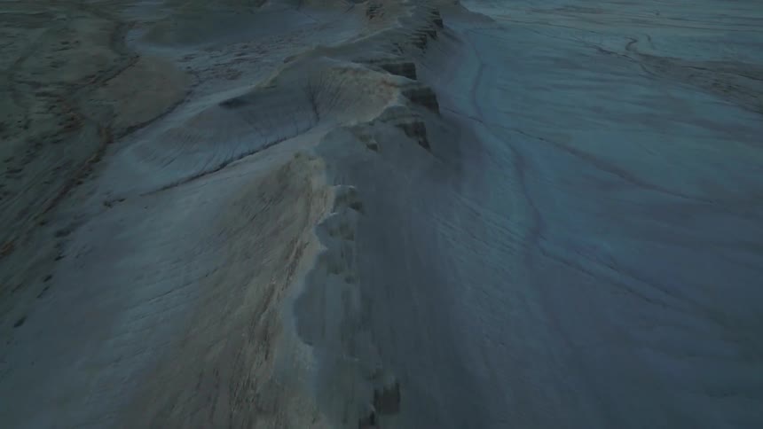 Sandy hilly desert at sunset