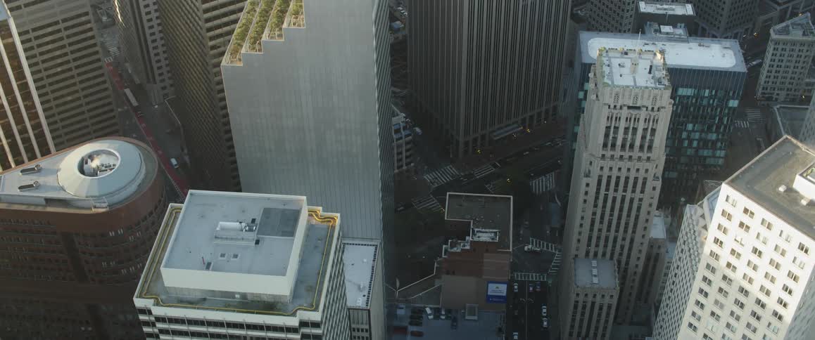 Sun shining over skyscrapers in a large city