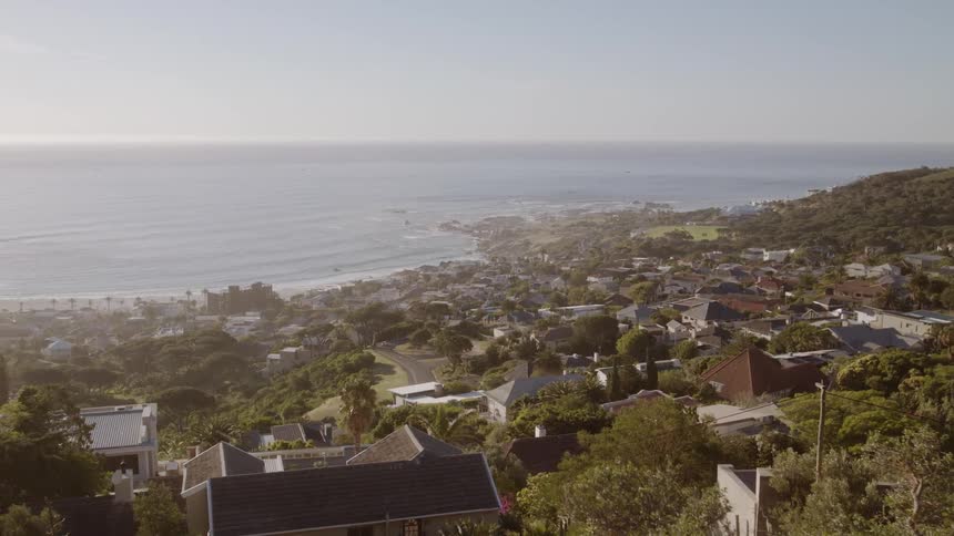 Rooftops of homes near the beach and coast on a sunny day