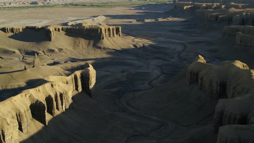 Shadows over hilly desert landscape