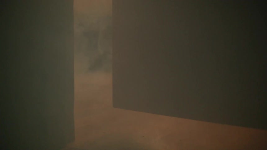 The smoke quickly rolls under the door