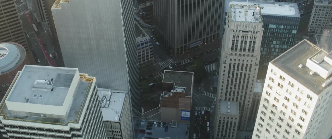Sun shines down over skyscrapers in a large city