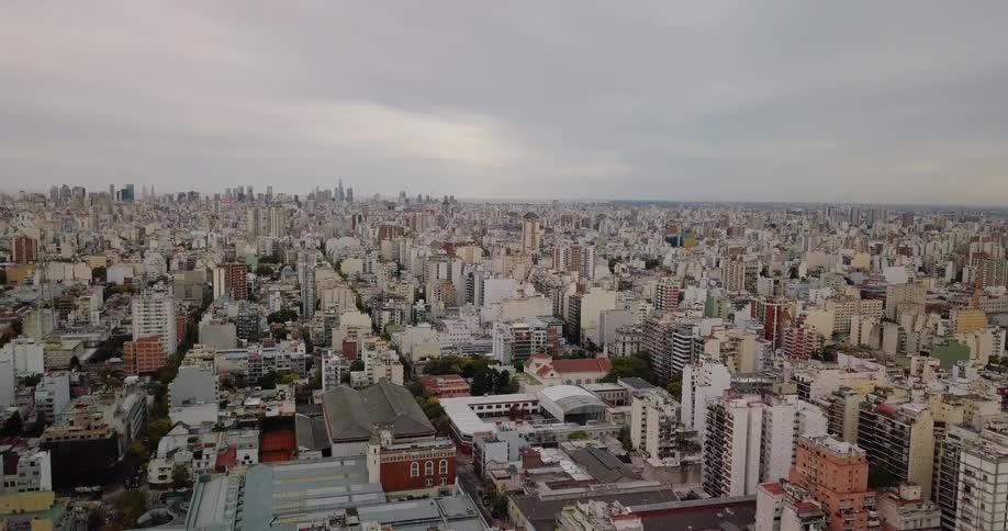 The sky above the city is completely covered with clouds