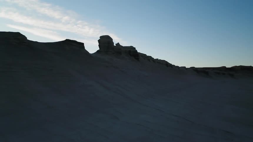 A ridge of rock formations in a barren landscape