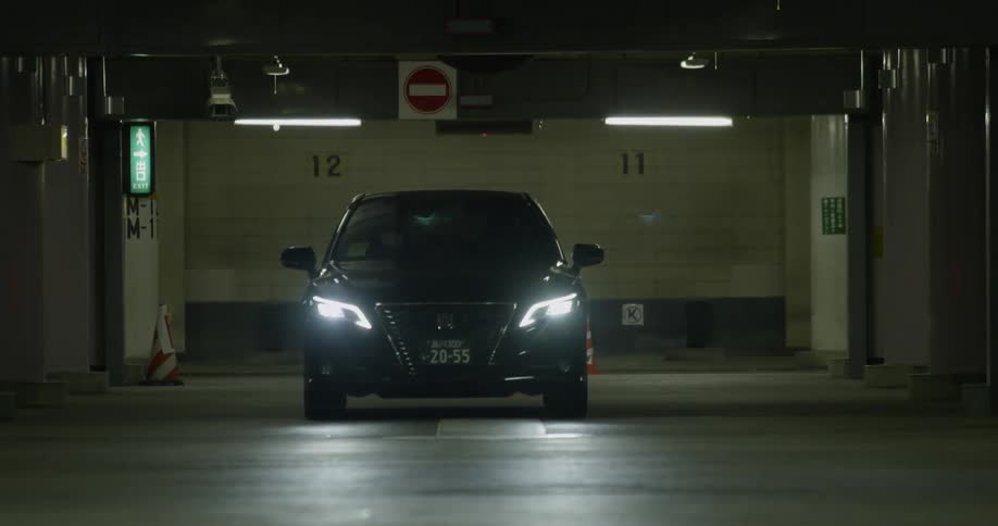 A car exits a parking garage