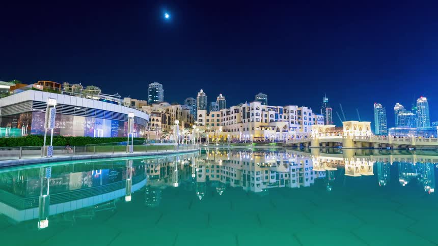 The water is calm by the city