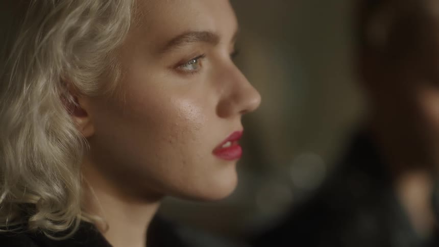 Woman stares off into the distance