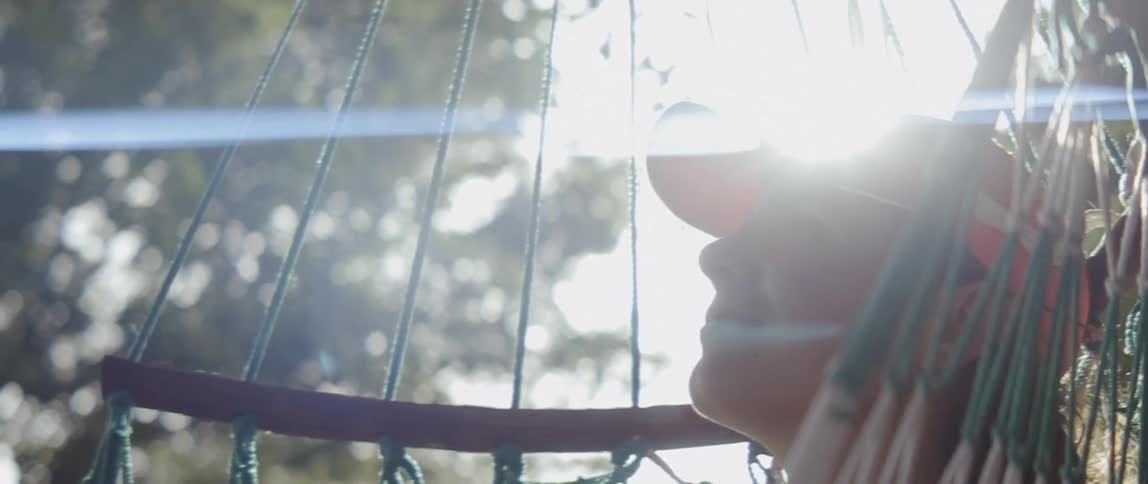 A woman rests in a hammock