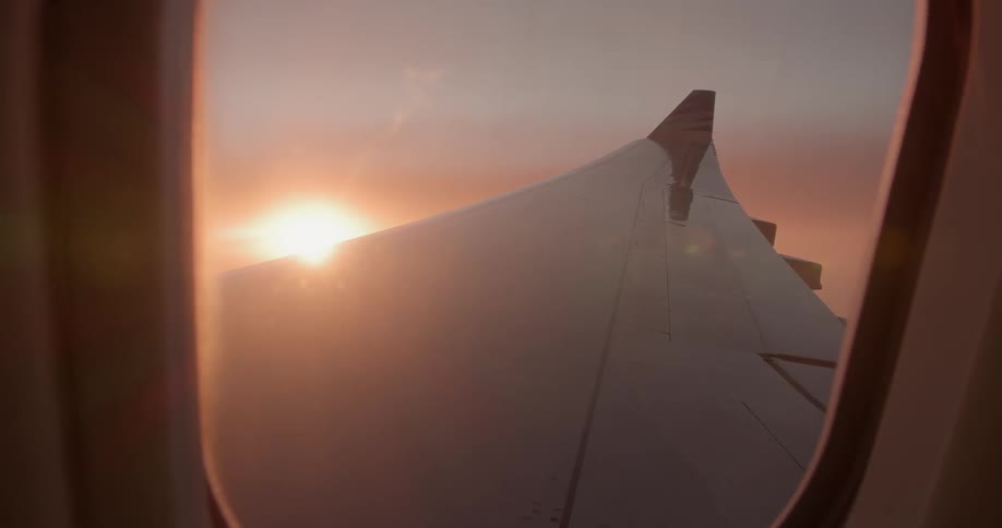 Sun shines over an airplane wing
