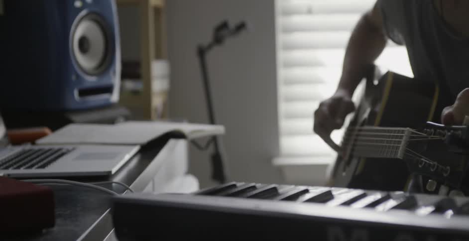 A musician tunes his guitar