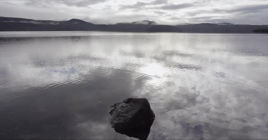 Water flows in a lake on a cloudy day