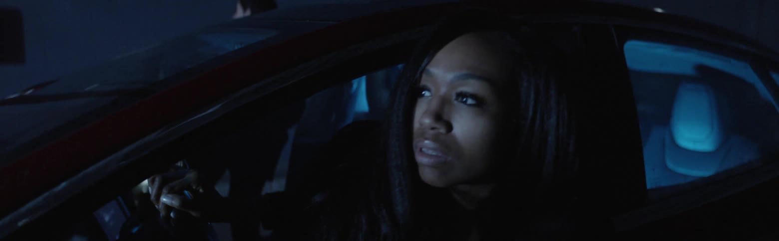 The two people get out of the car at night