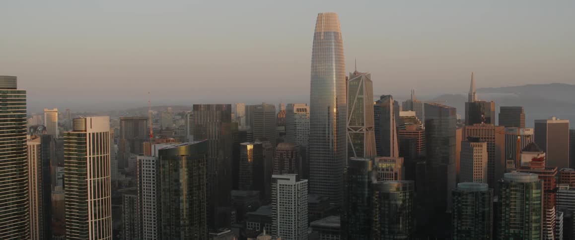 Sunlight reflects on skyscrapers and city buildings
