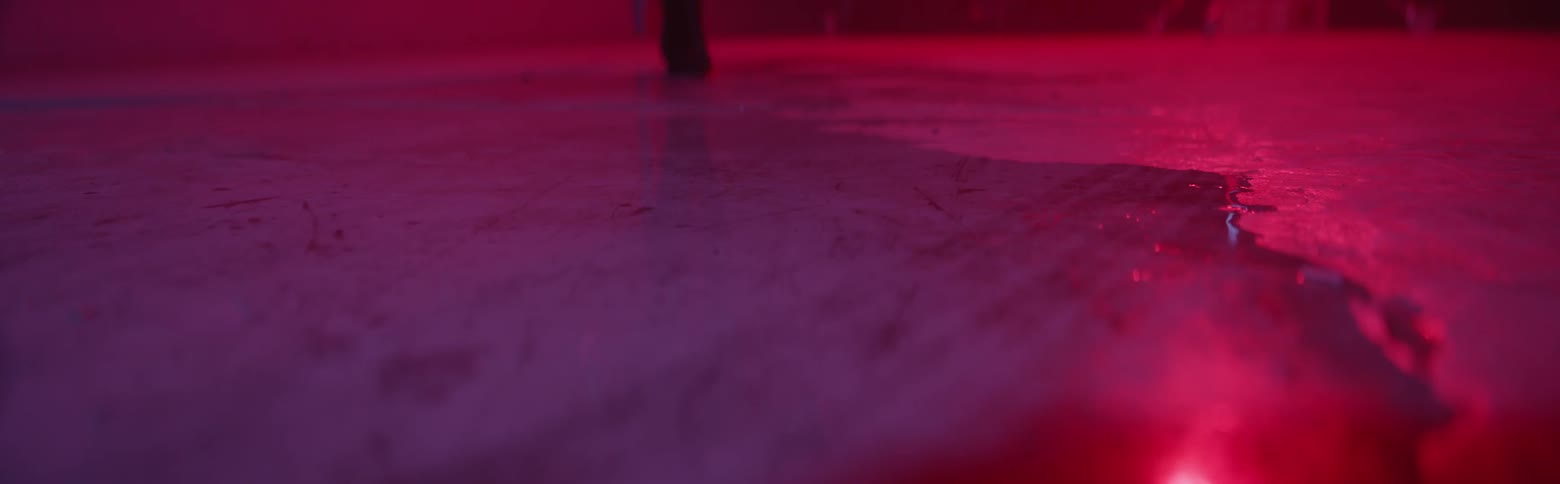 A woman walks on the ground in ankle boots