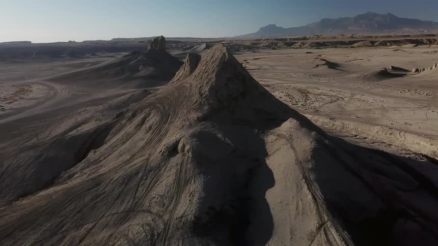 The sun is beaming down on a desert landscape on a sunny day