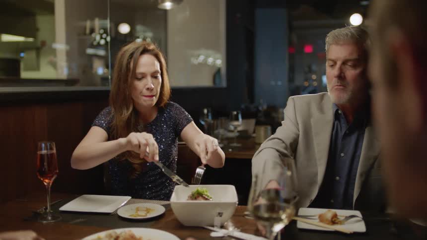 People eat dinner in a restaurant