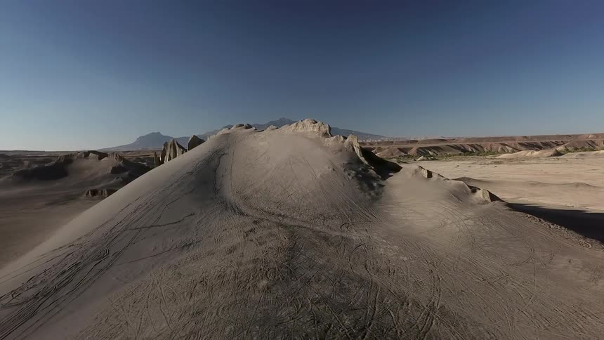 Bare dirt hills on sunny day in the wilderness