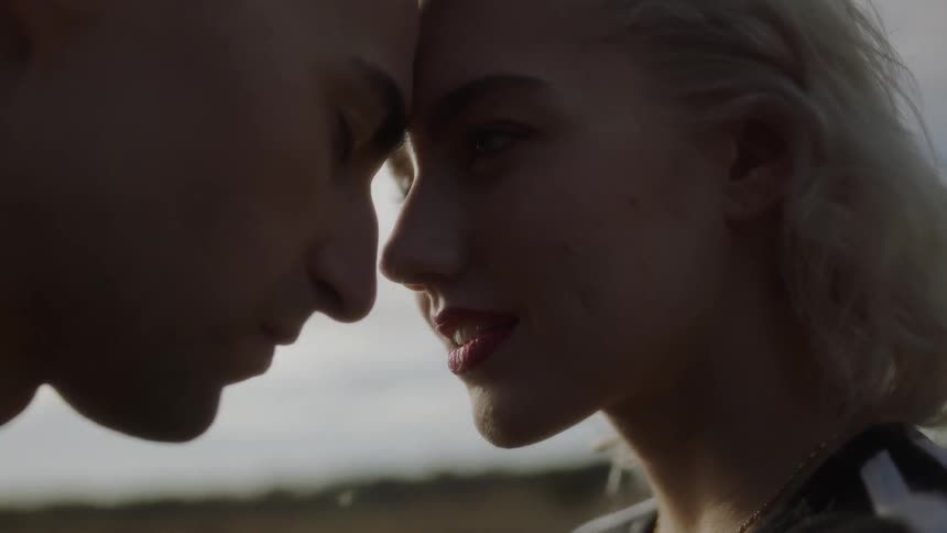 Man and woman rest their foreheads together