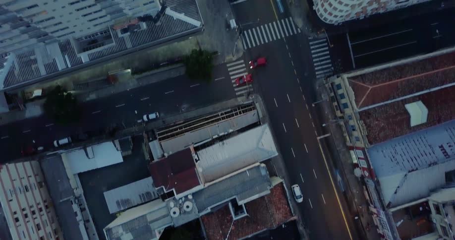 Vehicles driving down roads in a large city