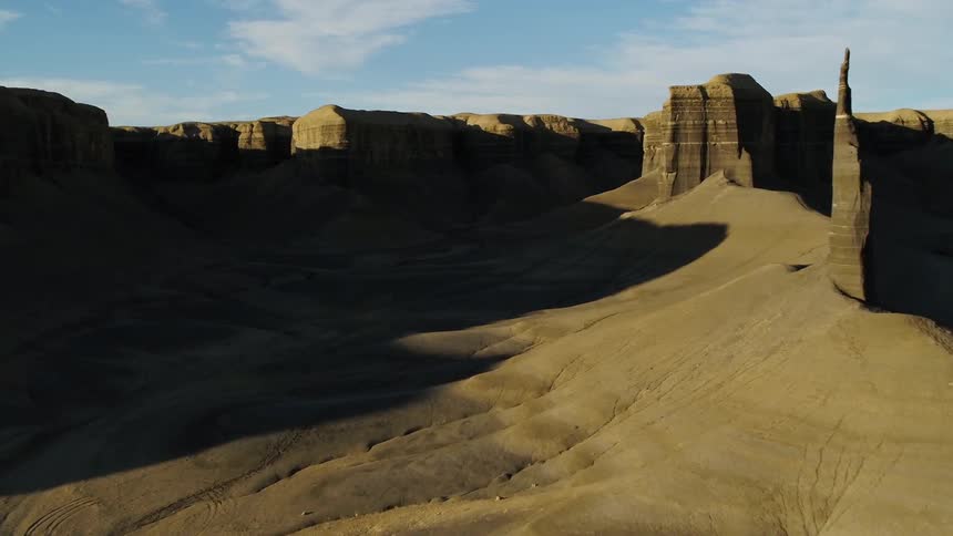The desert leads to a mountain range