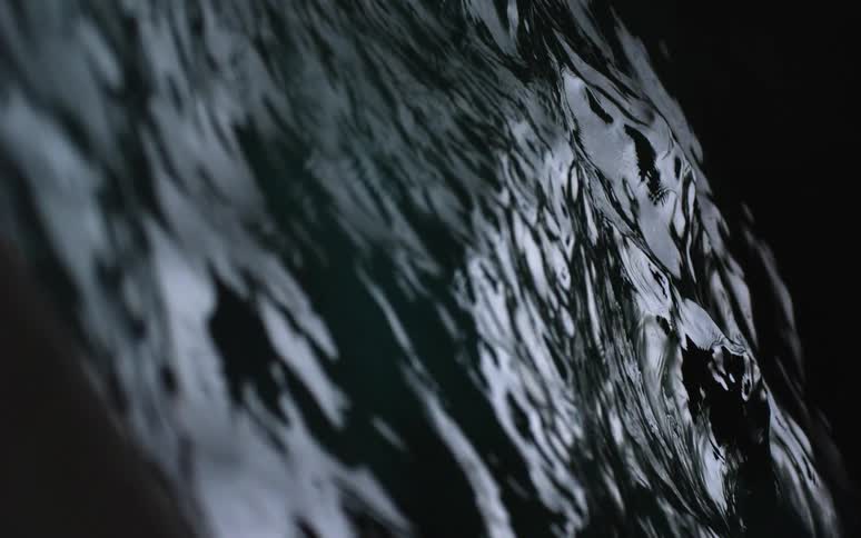 The water splashes around in the dark