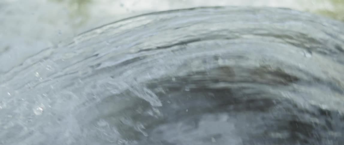 Water splashes and flows downward