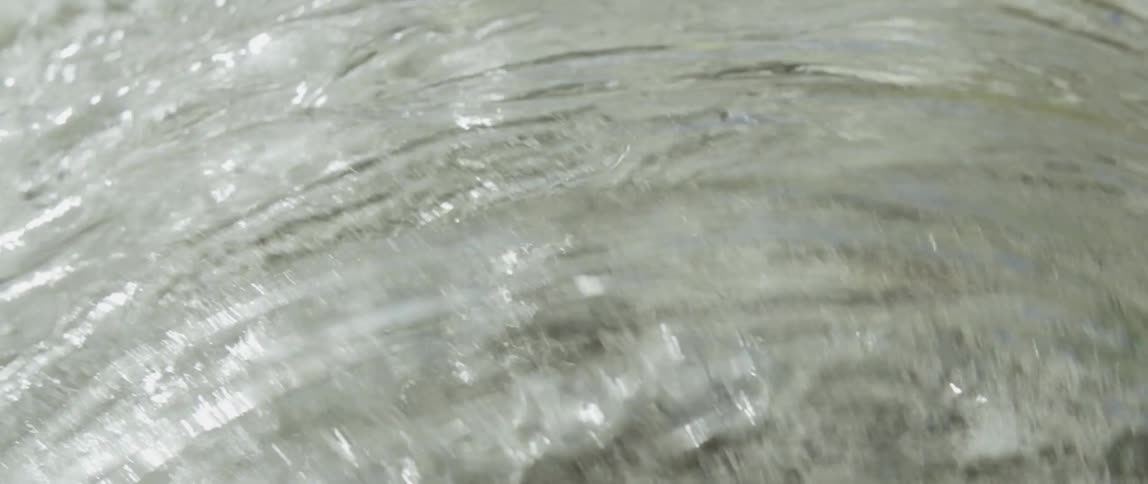 Sun shines off of clear flowing water