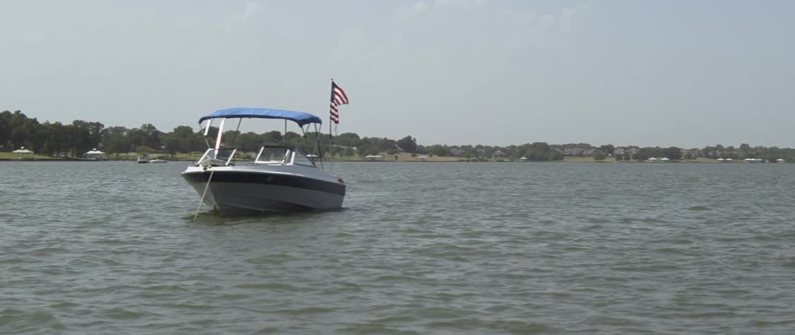 A boat sits on the flowing waters