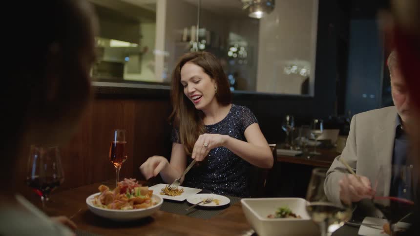 A group of people dine at a restaurant