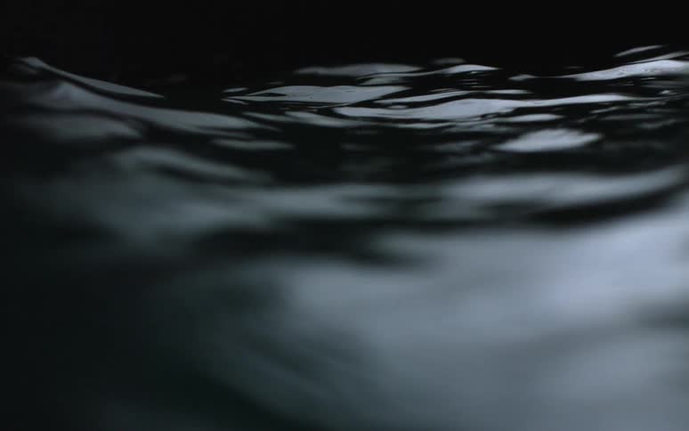 Water flows in a dark area