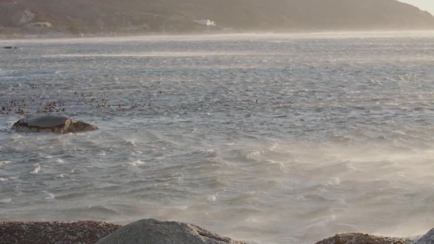 Water ripples and mists near the beach