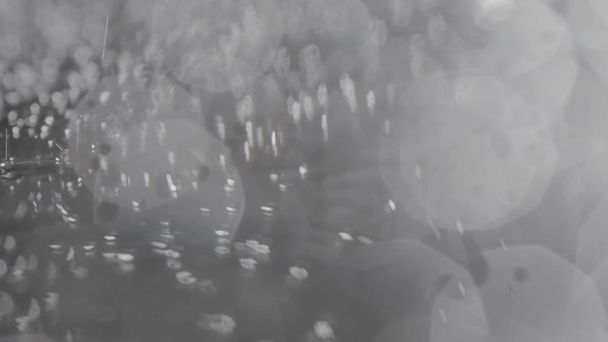 Water is trickling and rolling off of surface