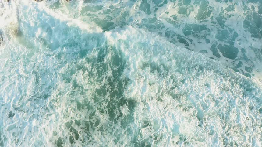 Water flows and splashes on a sunny day