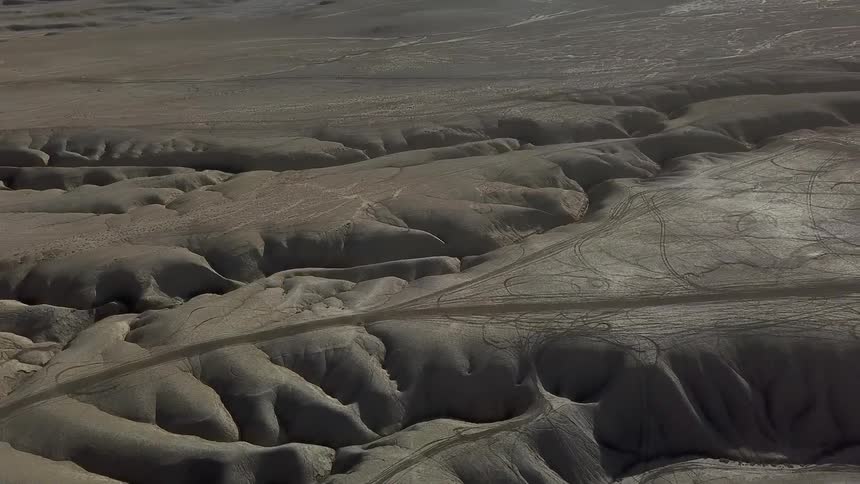 Sand dunes cover the open landscape