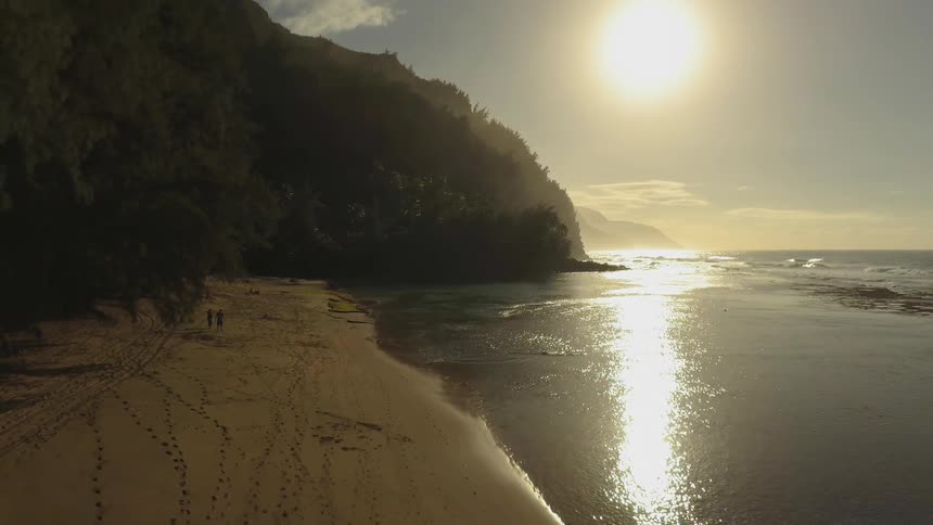 The sun shines on the beach shore