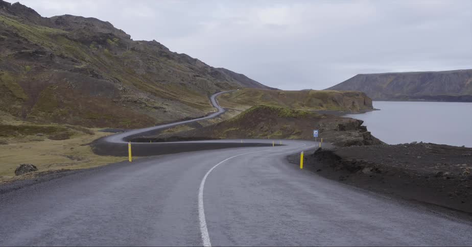 A winding road is stretched across the shore