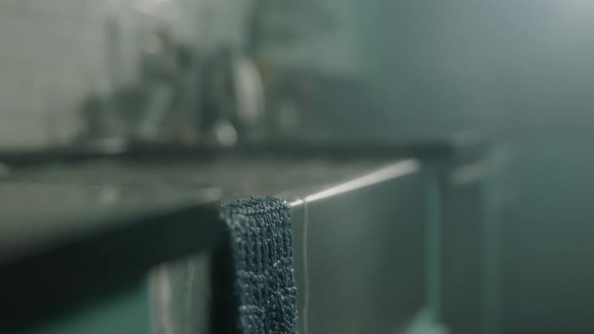 Water is overflowing and dripping out of kitchen sink