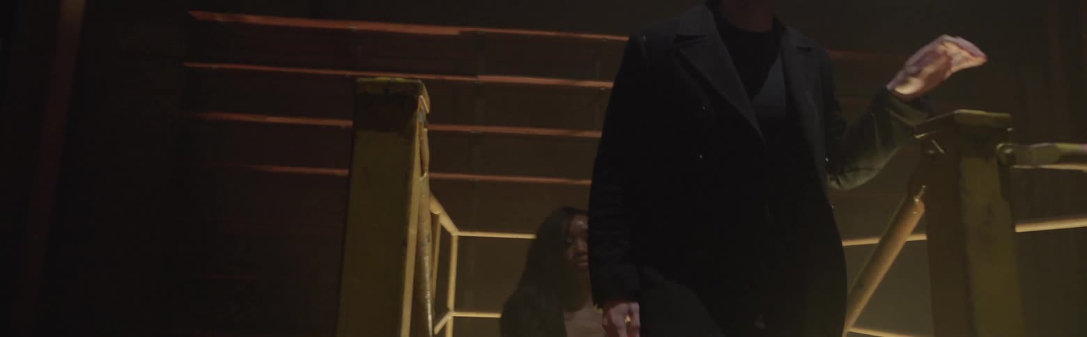 Man and woman climb up stairs