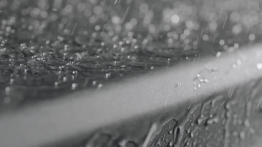 Water pours over the rim