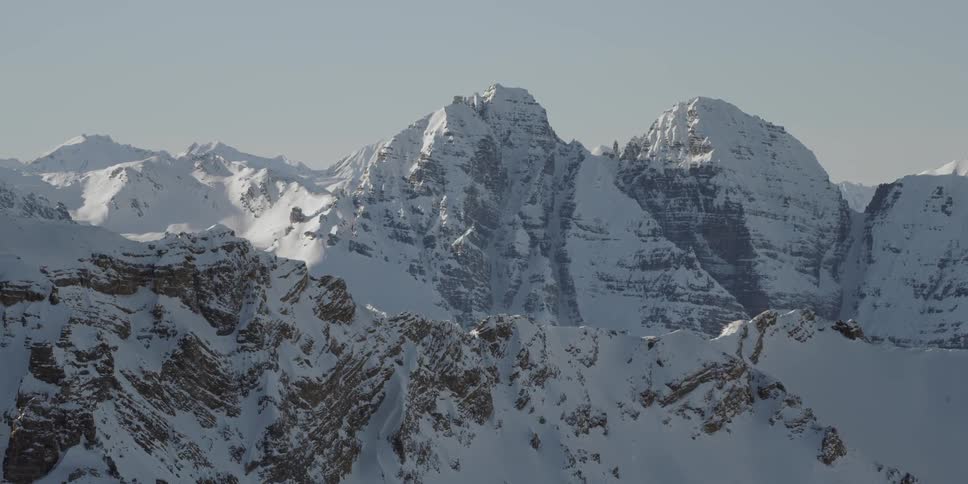 Snow covers the mountainous landscape