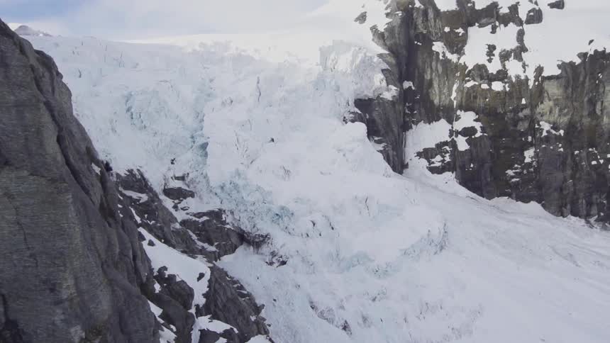 A snow covered mountain during the day
